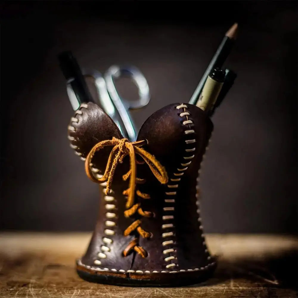Handcrafted leather corset desk organizer and pen holder in brown with tan lacing and white stitching detailing