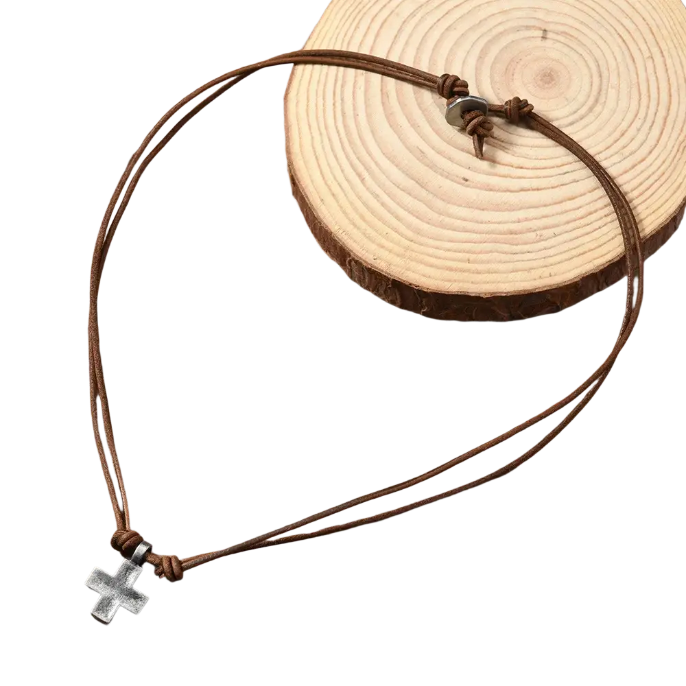 Brown leather cord necklace featuring a silver-toned alloy cross pendant for stylish everyday wear