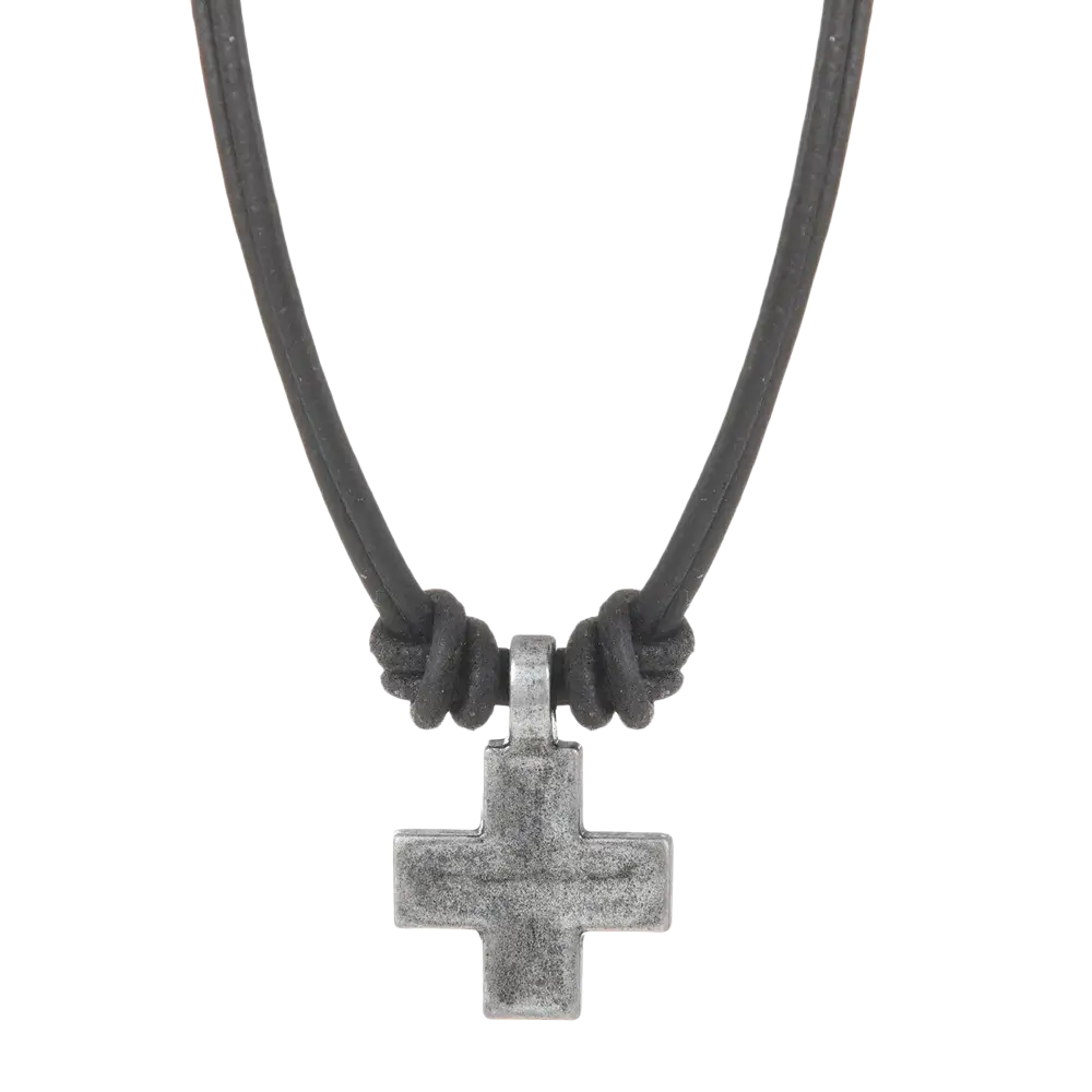 A rustic silver-toned alloy cross pendant hanging from a black leather cord in a leather cross necklace