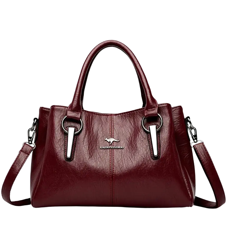 Burgundy leather crossbody handbag with silver-tone accents and kangaroo logo featuring a pocket interior
