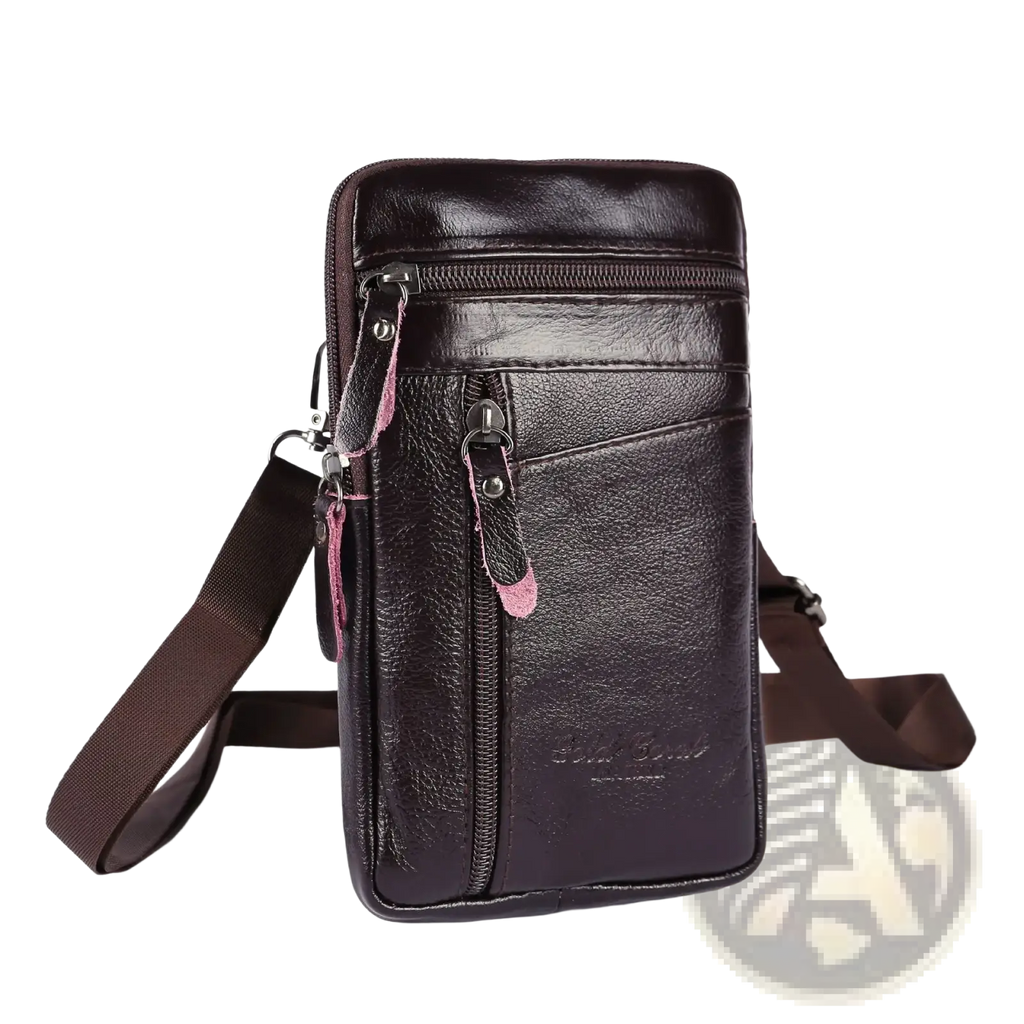 Dark brown leather crossbody phone pouch belt bag with pink zipper pulls and matching adjustable strap