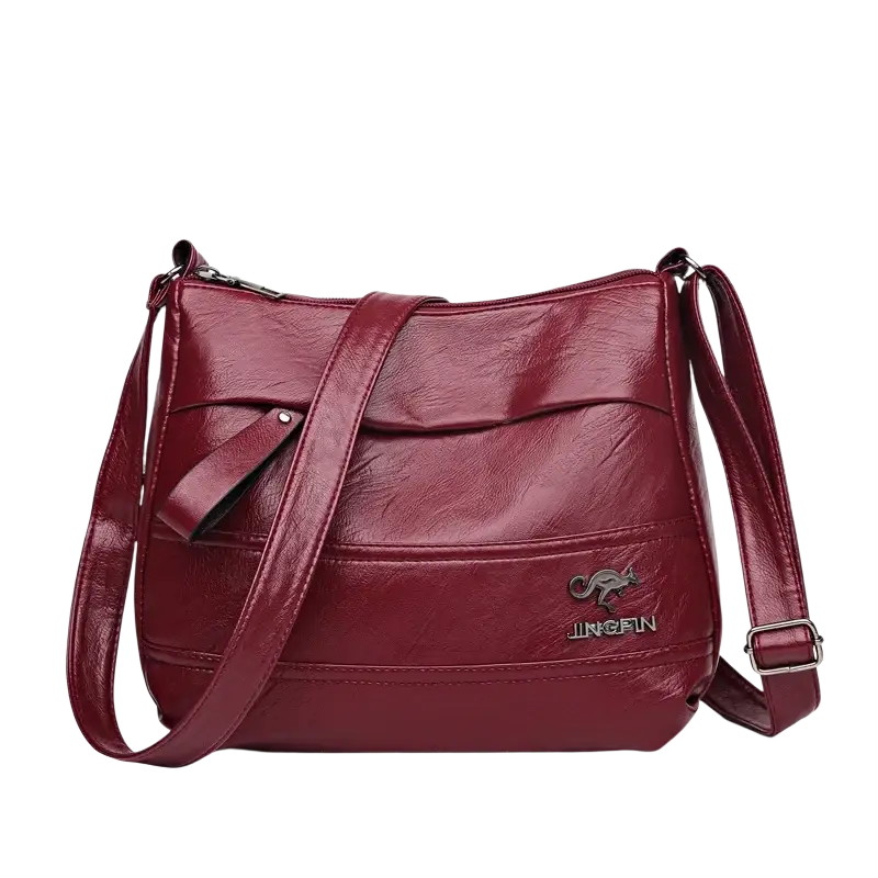 Burgundy leather crossbody shoulder handbag shopping bag with kangaroo logo adjustable strap and pocket interior
