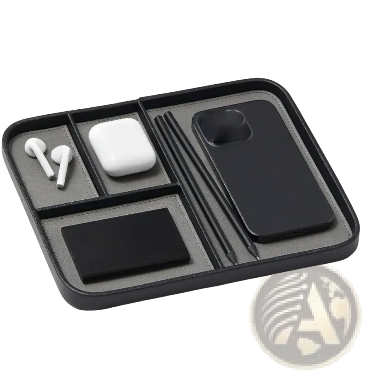 Black leather desktop organizer tray with segmented compartments holding earbuds phone case stylus pens and card