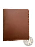 Minimalist brown leather driving license wallet for men with visible stitching along the edges