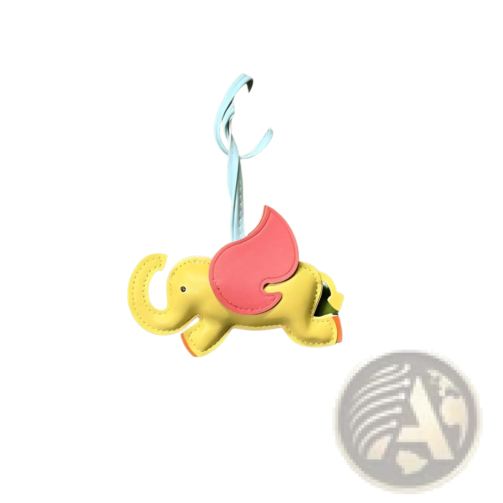 Leather elephant bag charm featuring a cheerful yellow elephant with pink wings made from soft leather attached to a light blue strap