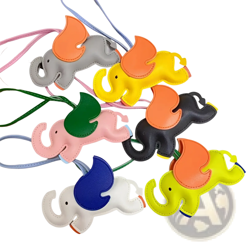 Leather elephant bag charm and slim card holder set featuring colorful stitched elephant-shaped keychains with vibrant accents