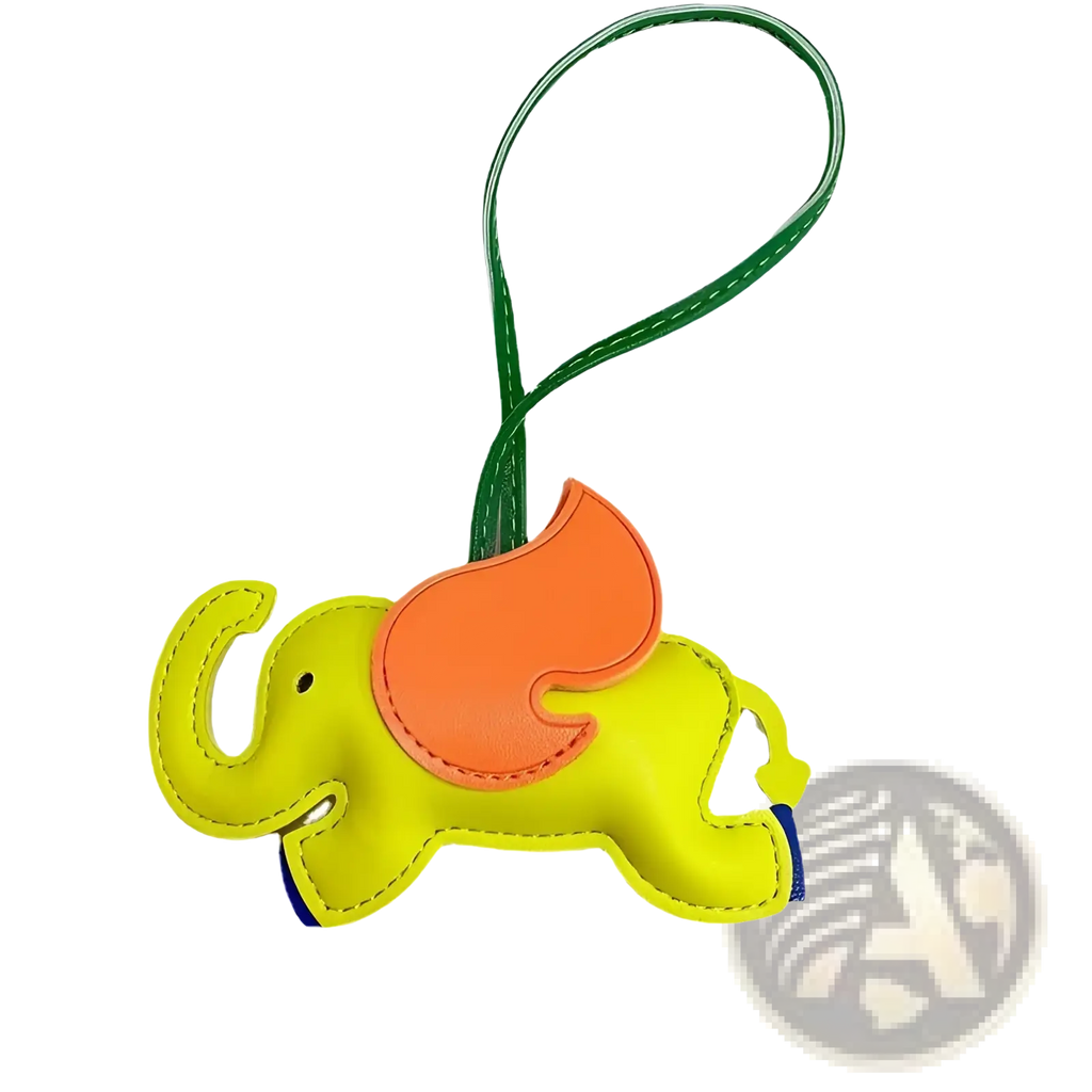 Bright yellow leather elephant bag charm with orange wing and green strap keychain for stylish accessory use