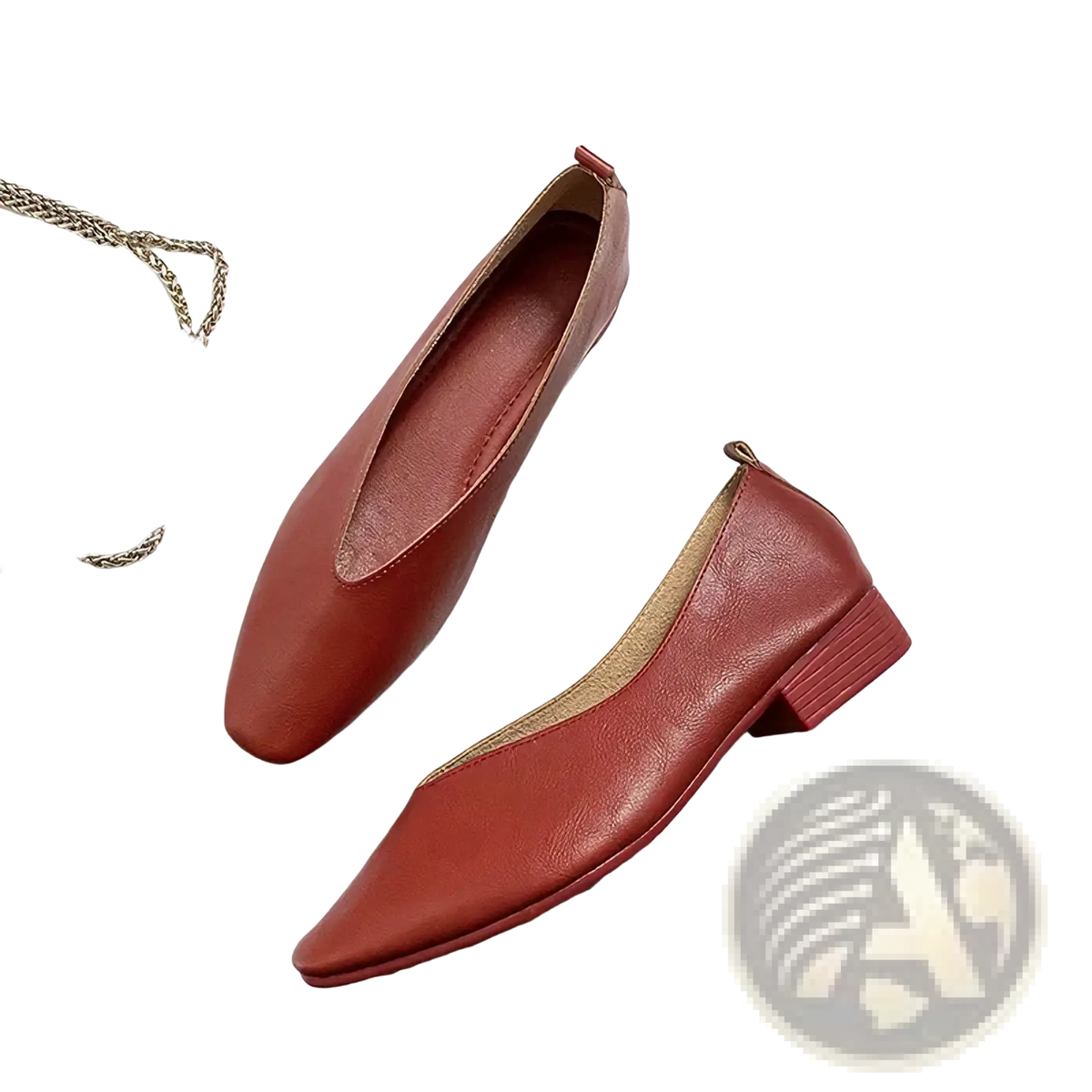 A pair of elegant red leather flat shoes for women with a pointed toe and low block heel slip on design
