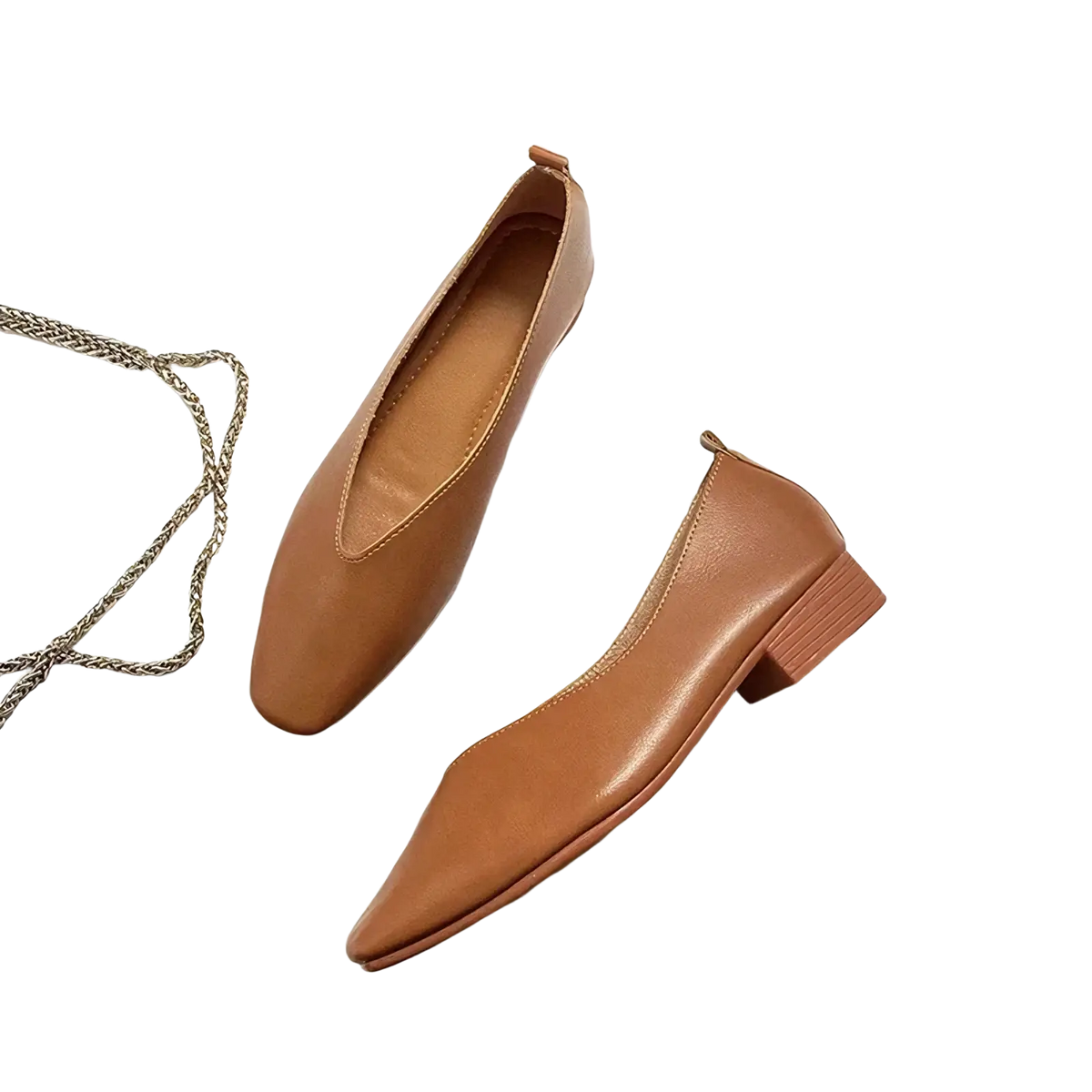 Tan leather loafers for women featuring a low block heel and pointed toe, ideal for casual slip-on wear