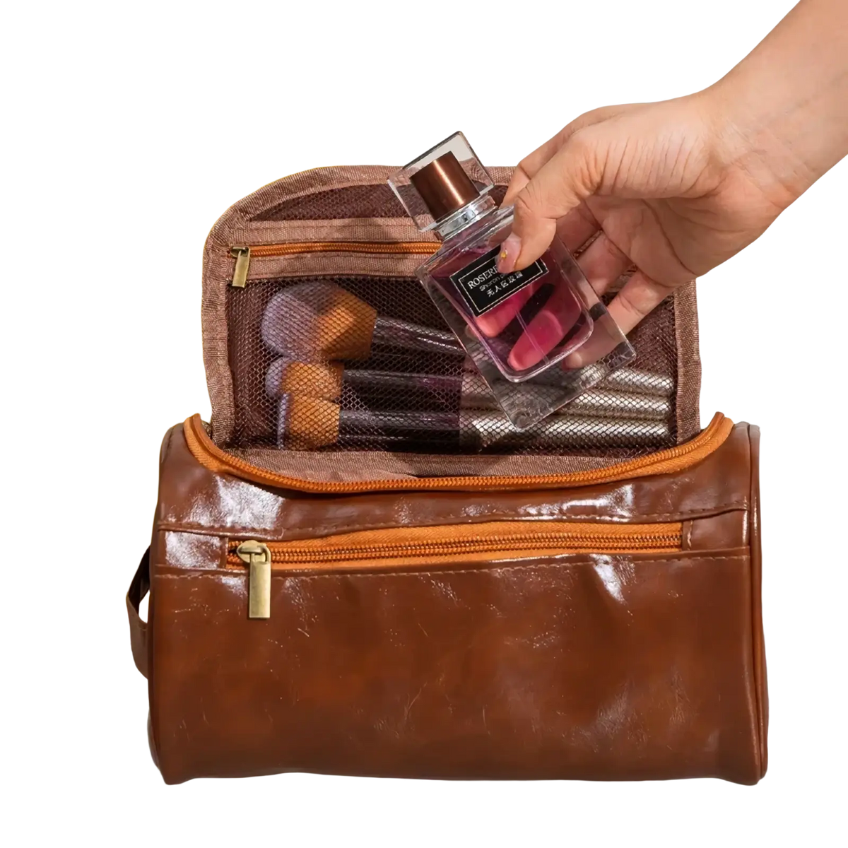 Leather hanging toiletry bag in brown leather with orange zipper accents and mesh interior compartments for travel