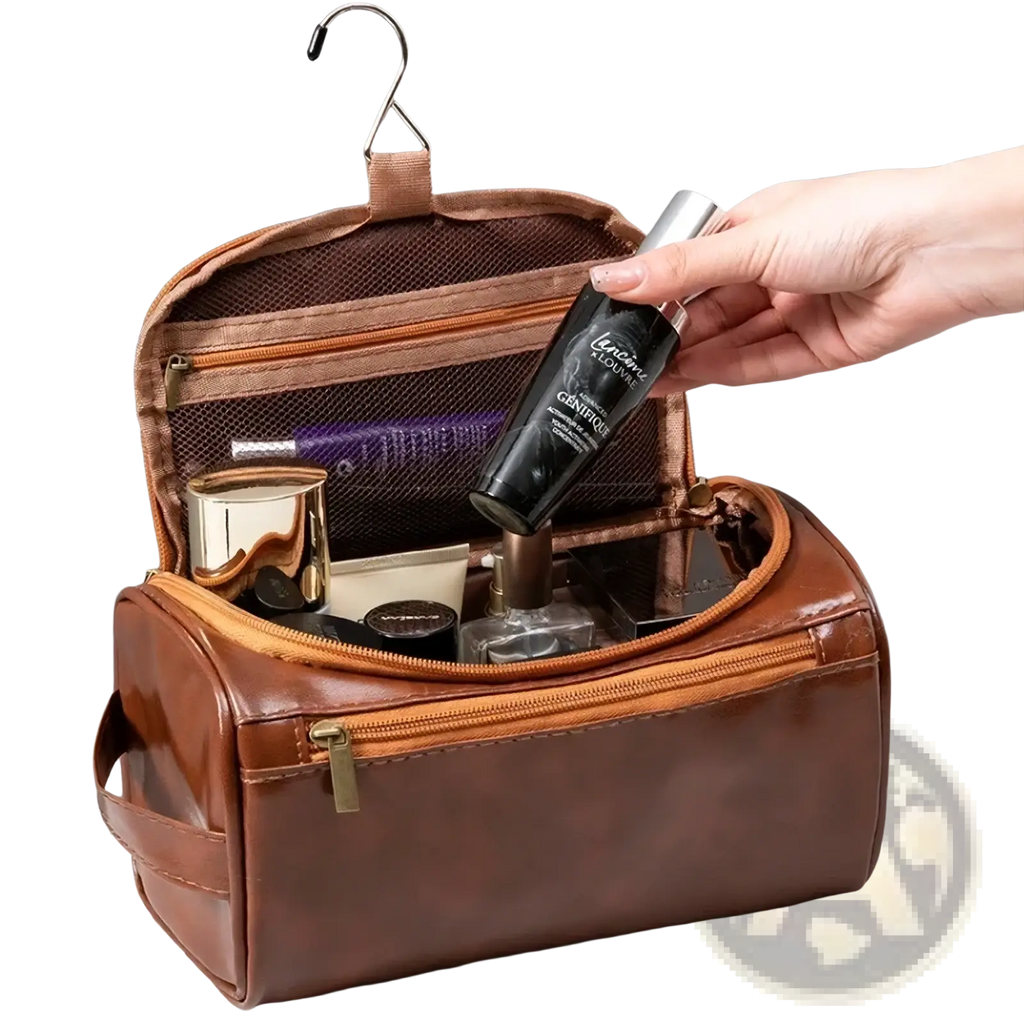 Brown leather hanging toiletry bag for travel with multiple zippered compartments and a convenient hanging hook