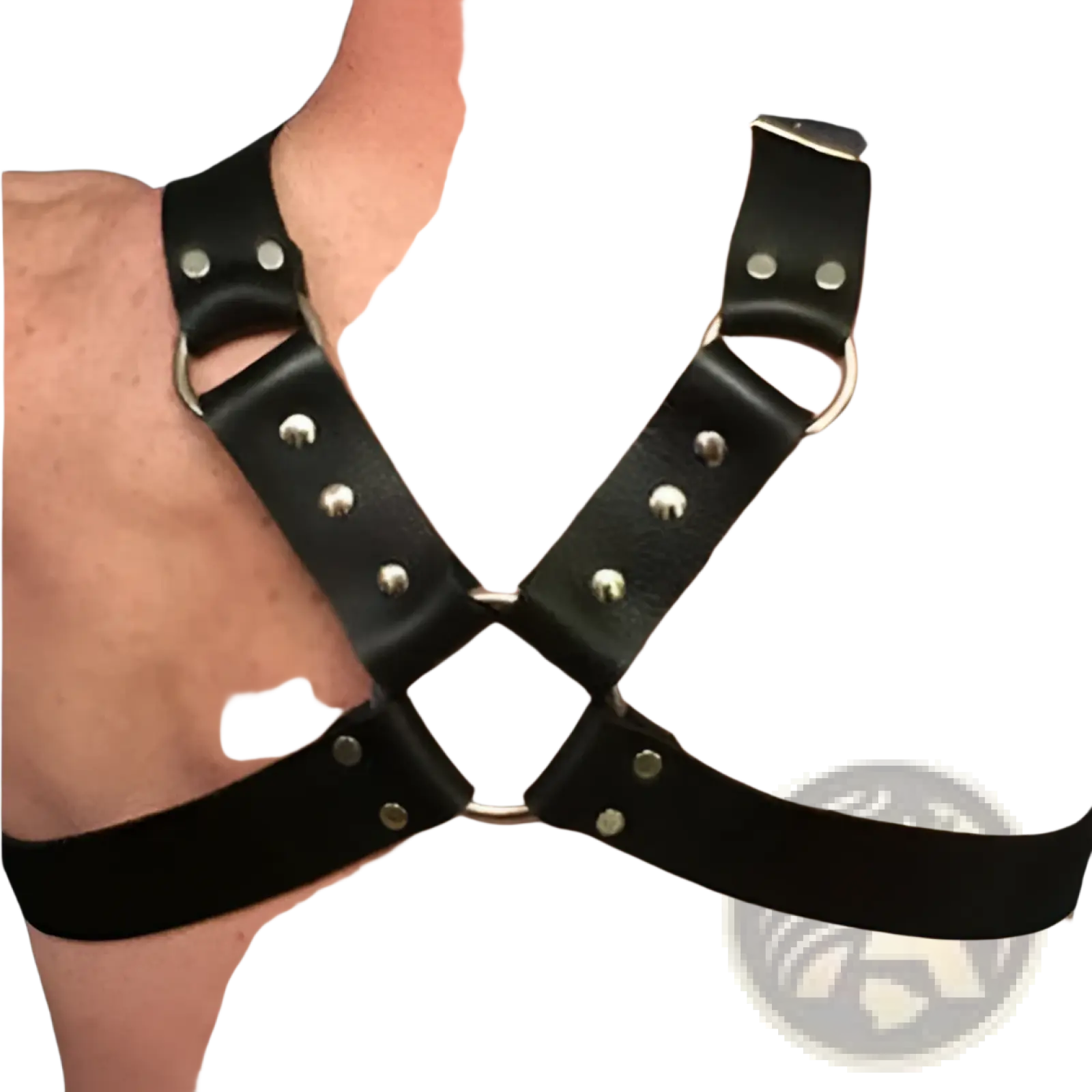 Black leather harness with silver buckles and metal studs designed for adult use and style