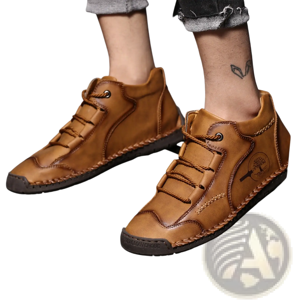 Leather high top sneakers in tan with visible hand stitching and a tree emblem on the side