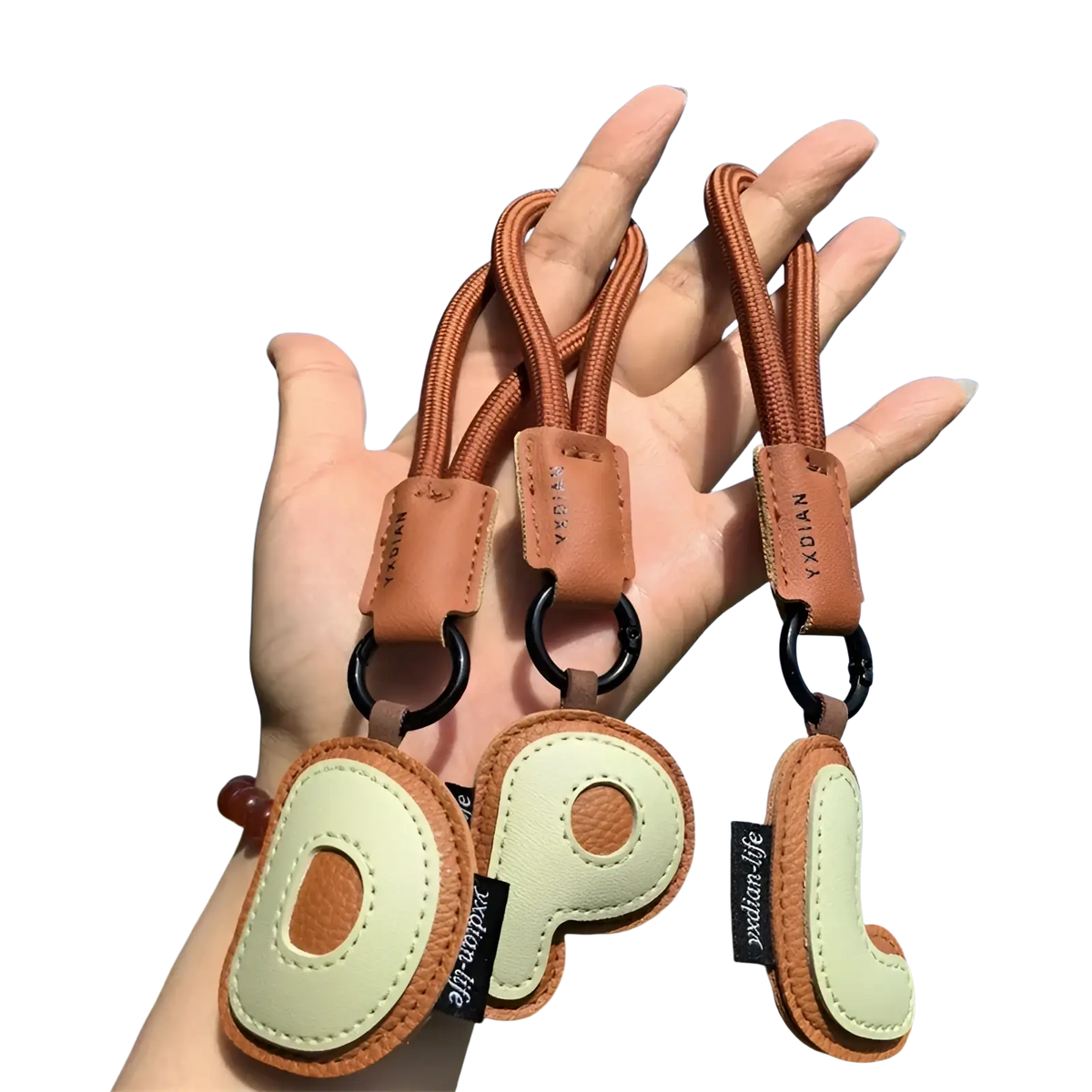 Brown and cream leather initial keychain letter wristband charm with braided cord straps for everyday use