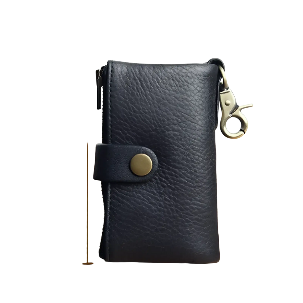 Black leather key chain wallet for men with textured surface brass-toned metal clasp and button closure