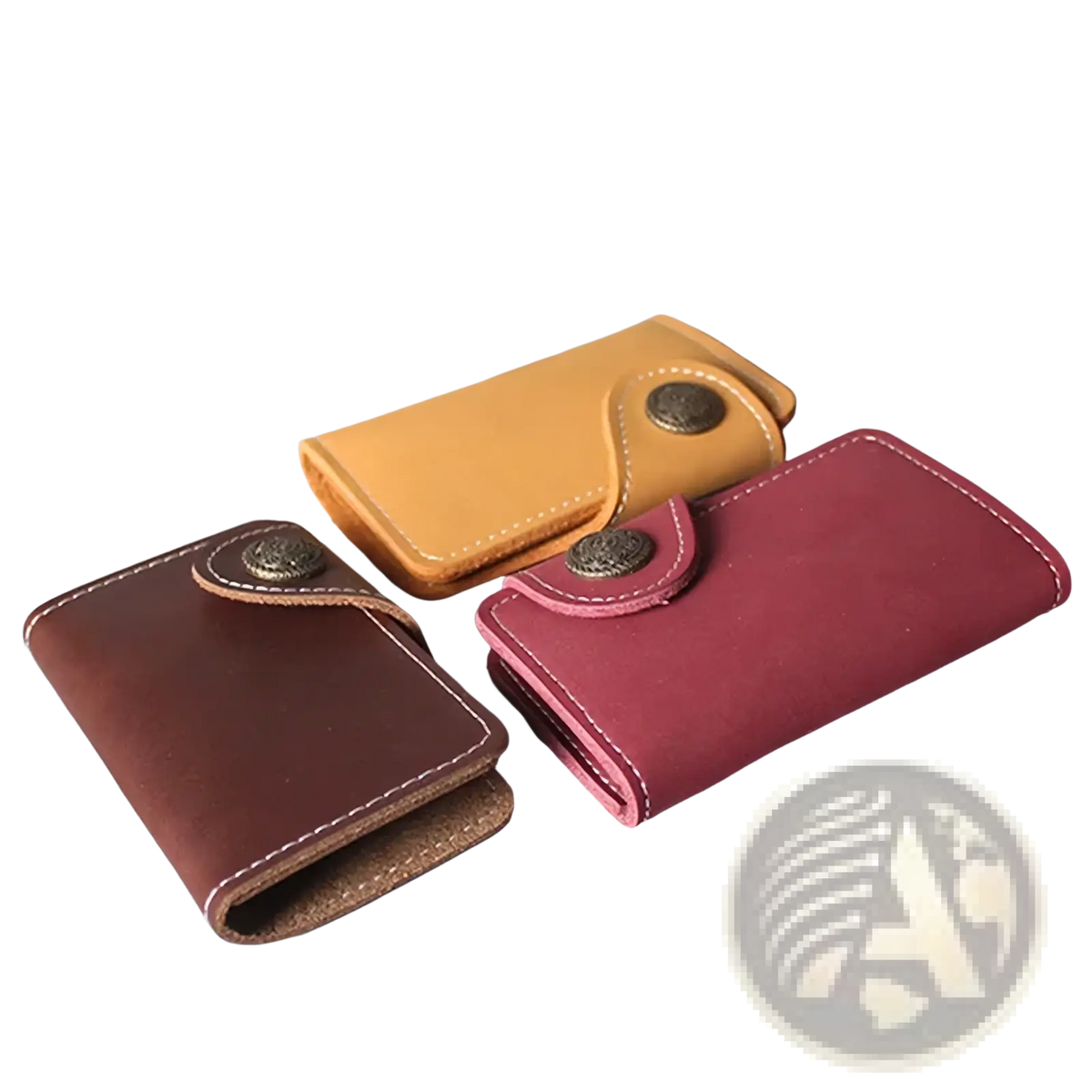 Three compact leather key pouch wallets with card holders in brown maroon and tan hues with vintage metal clasps