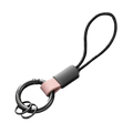 Black metal key ring with matte finish and pink leather strap attached to black cord loop for car key holder