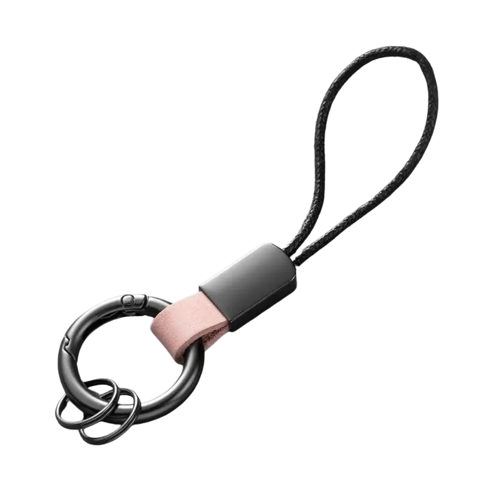 Black metal key ring with matte finish featuring pink leather strap and black braided cord for car key holding