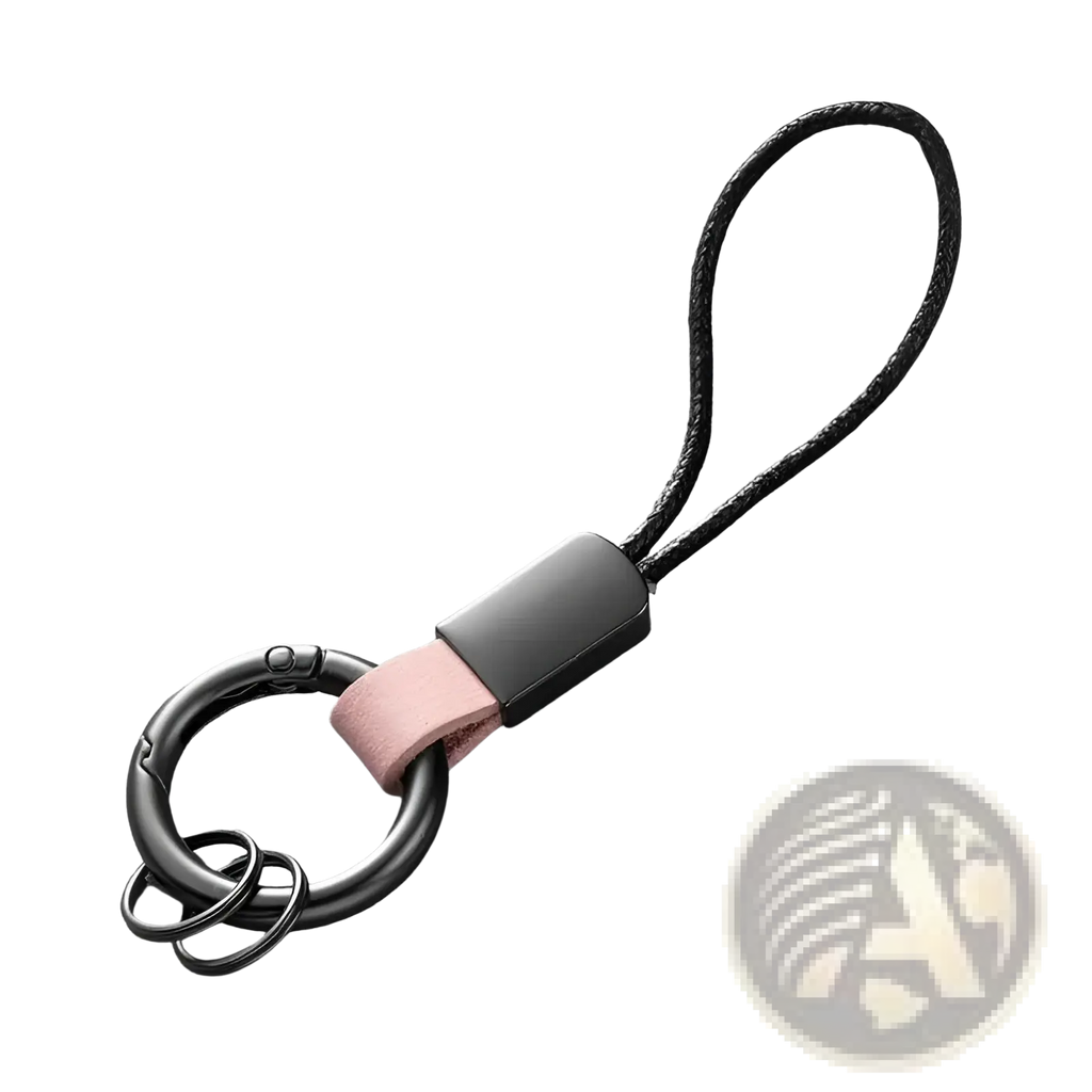 Black metal key ring with matte finish and pink leather strap attached to black cord loop for car key holder