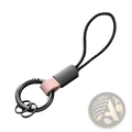 Black metal key ring with matte finish and pink leather strap attached to black cord loop for car key holder