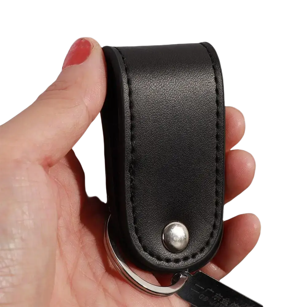 Black leather keychain with silver-toned metal clip ring holder and detailed stitching for secure key organization