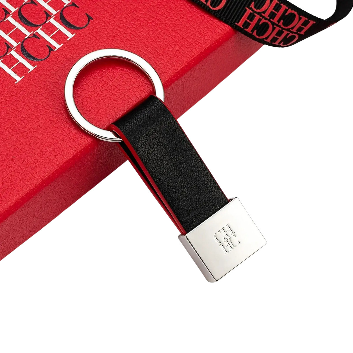 Black leather keychain minimalist luggage accessory with silver metal ring and engraved ch logo on rectangular plate