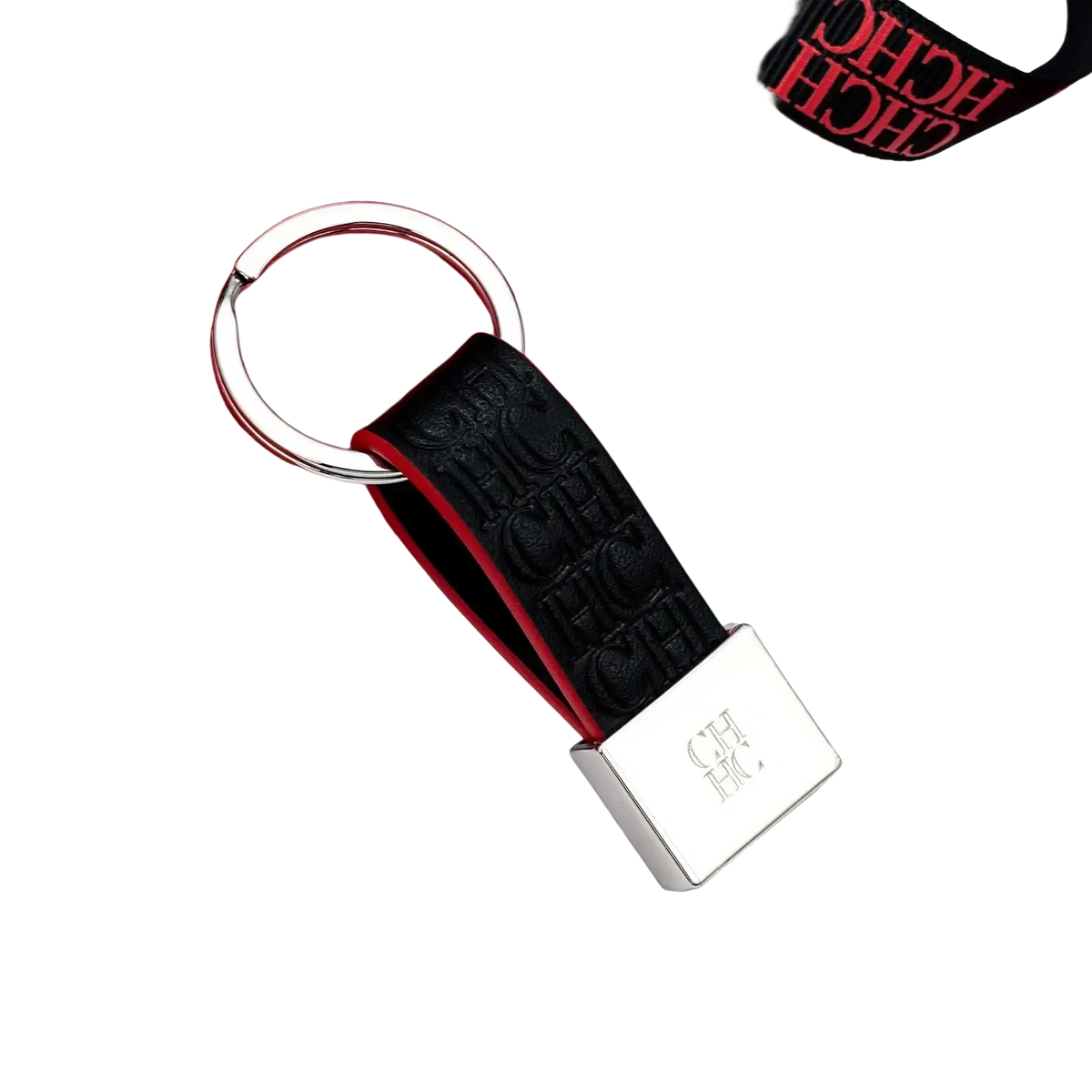 Black textured leather keychain with silver metal ring and embossed ch logo for minimalist luggage accessory