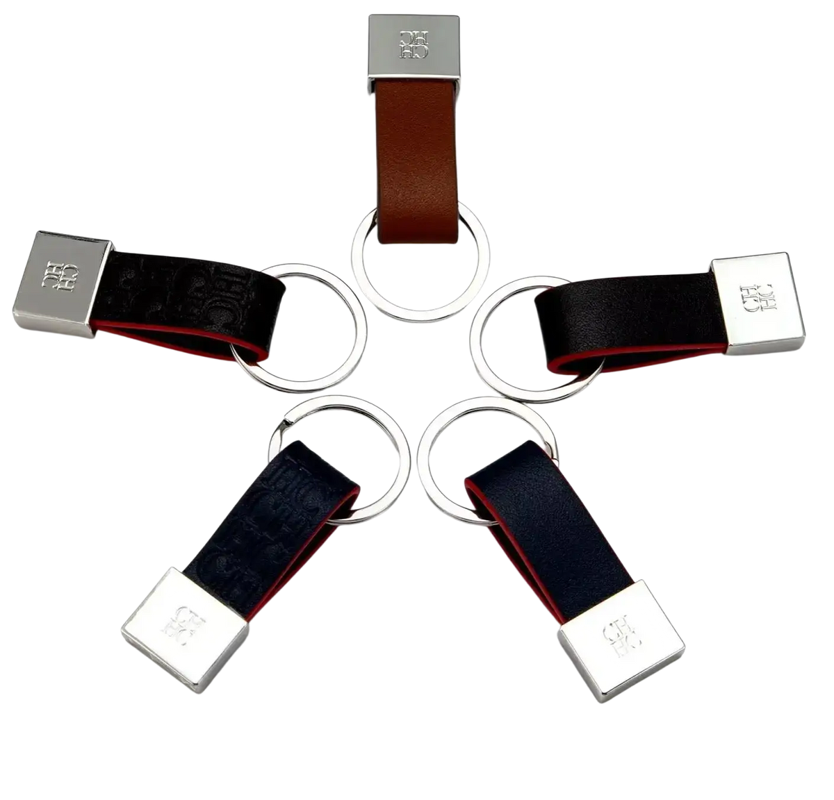 Leather keychain minimalist luggage accessory in brown and black leather with silver logo plate and circular ring attachments