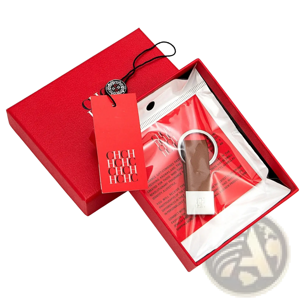 A sleek minimalist leather keychain with a silver metallic ring and brown leather strap for luggage accessory use