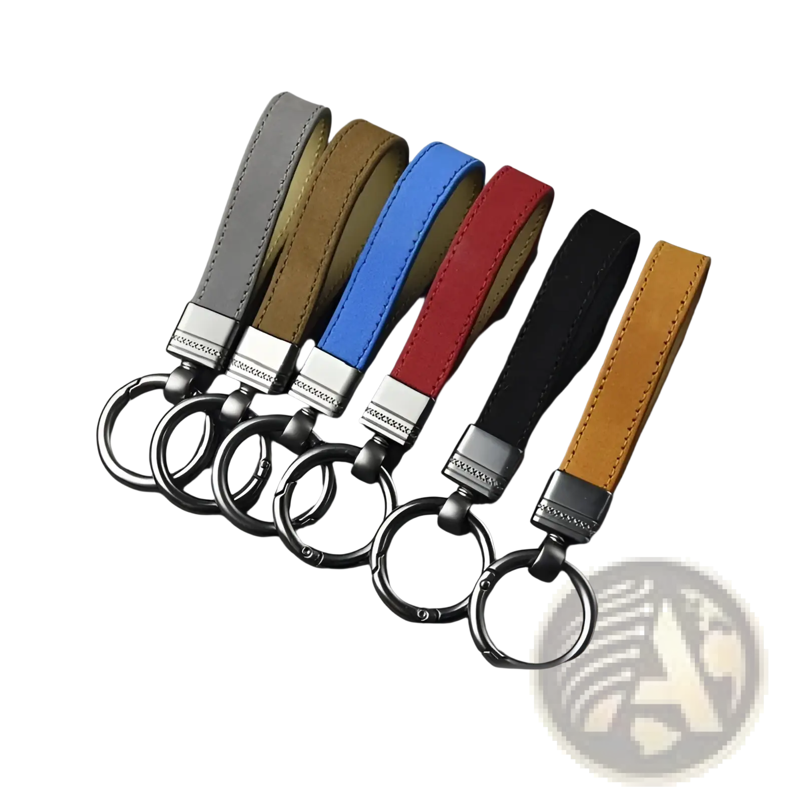 A set of six leather keychains in gray, tan, blue, red, black, and mustard yellow with silver metal clasps