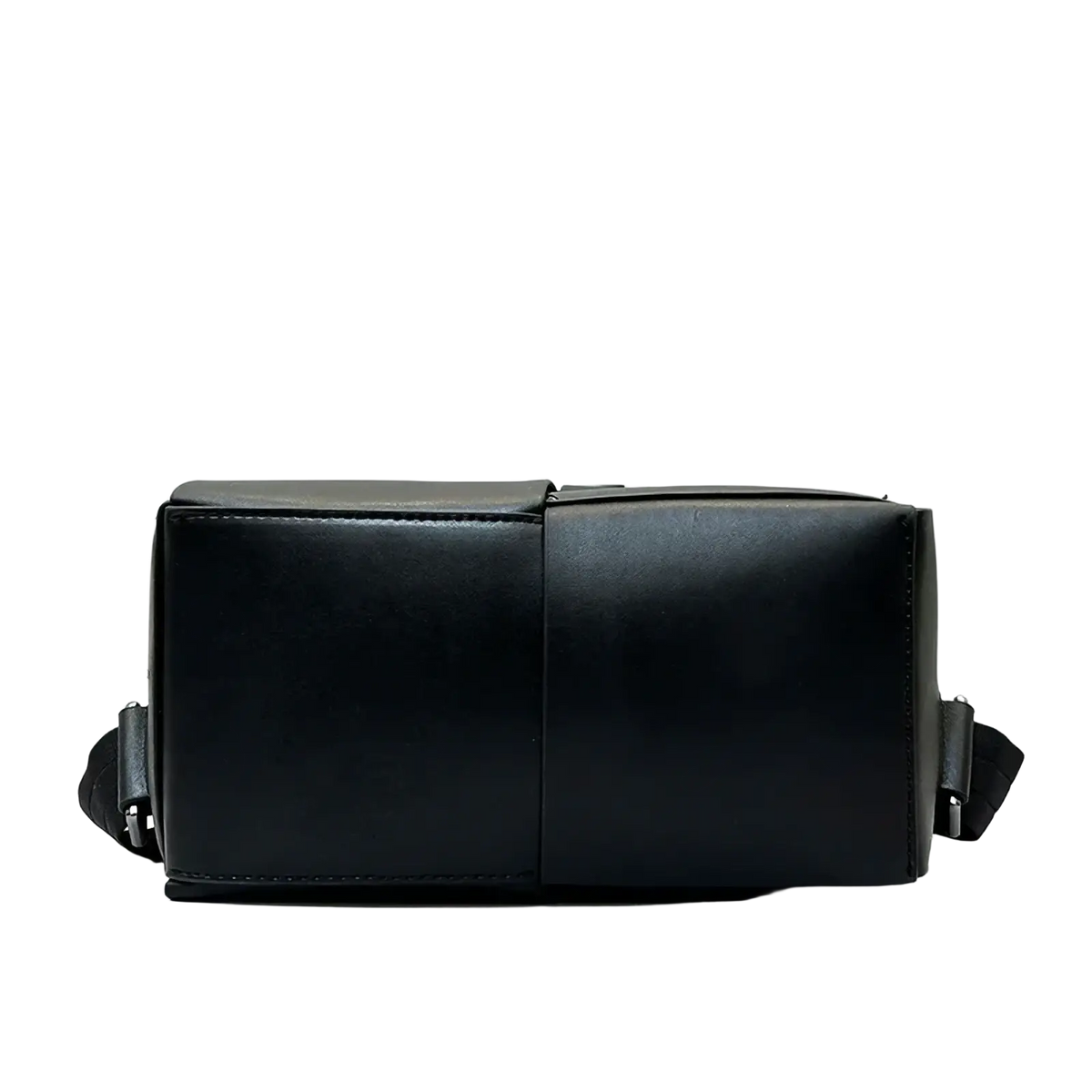 Black leather laptop backpack for men with a sleek minimalist design and structured rectangular crossbody bag shape