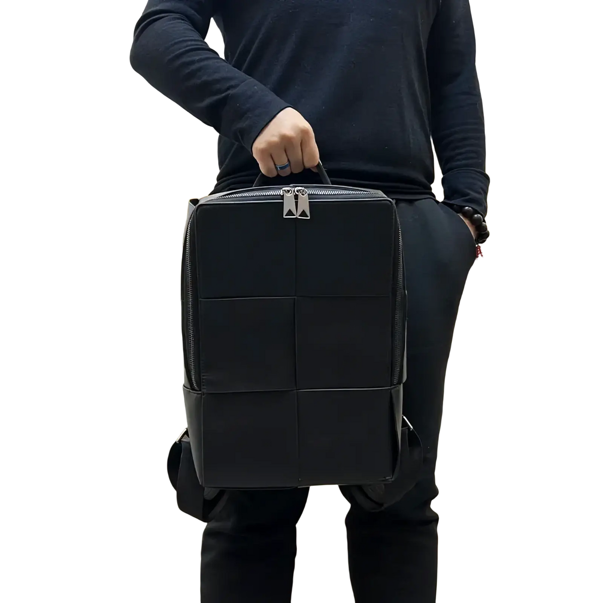 Black quilted leather laptop backpack for men with silver-toned zippers and structured rectangular design