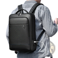 Black textured leather laptop backpack with multiple zippers and side usb charging port for business use