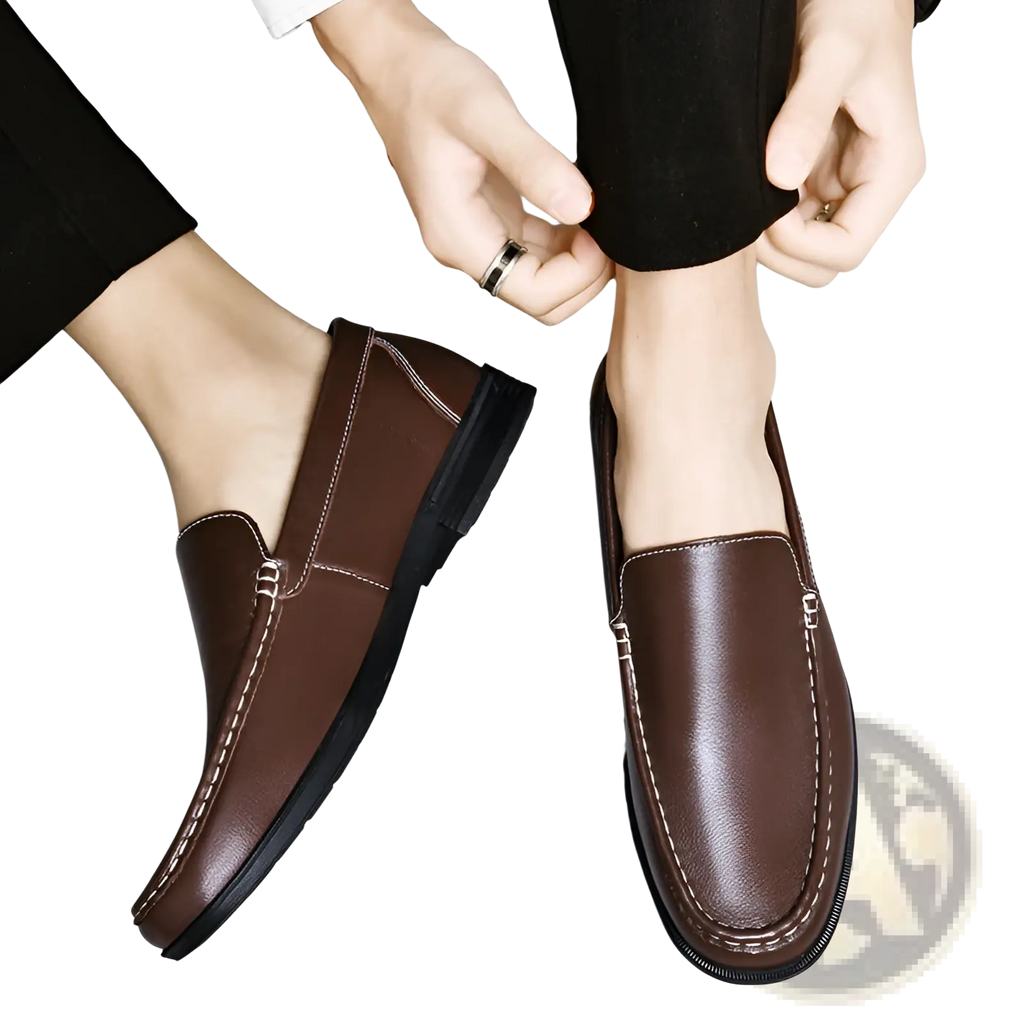 Brown leather breathable hollow business loafers with black soles and contrasting white stitching for formal use