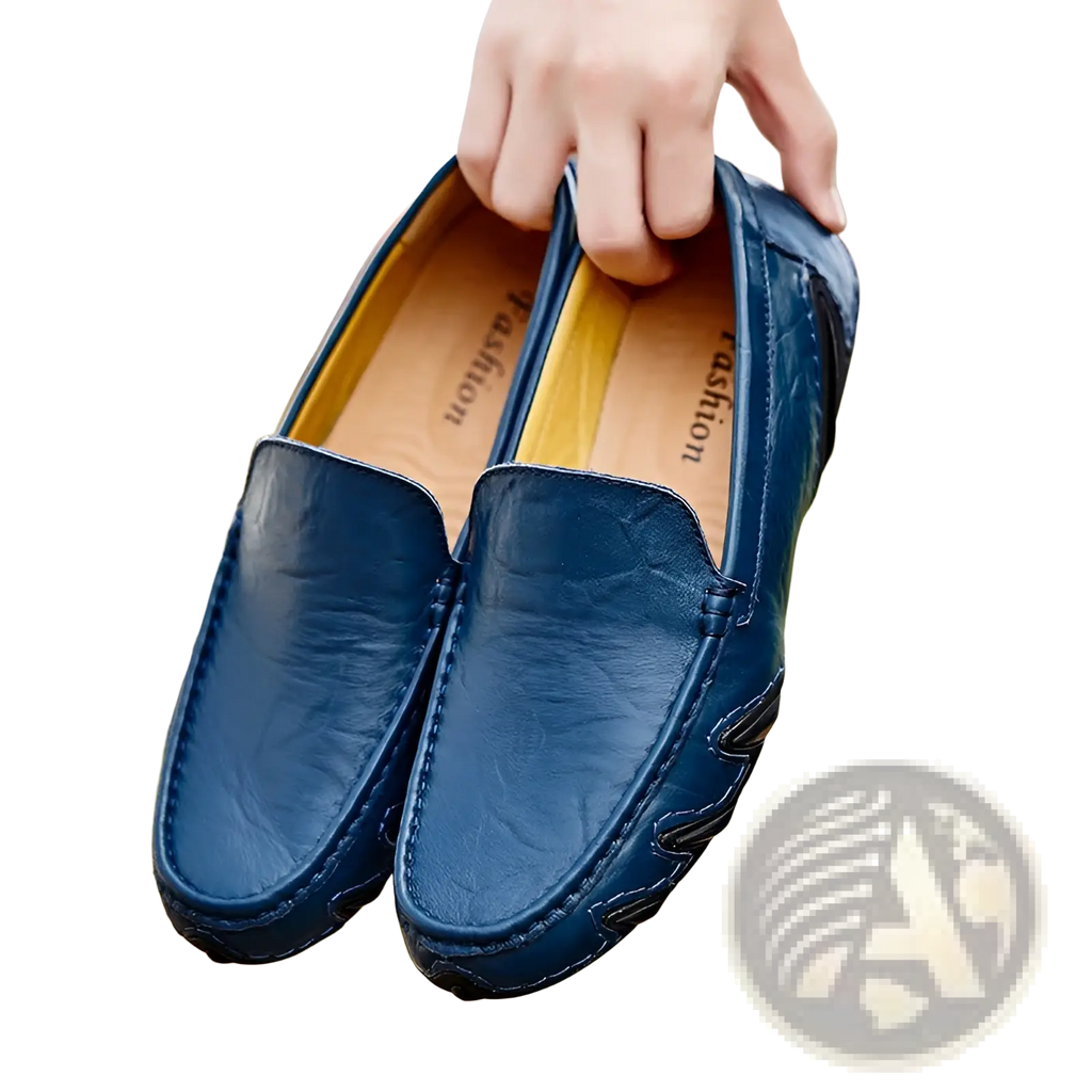 Dark blue leather loafers for men with subtle textured pattern and stitched detailing in retro British style shoes