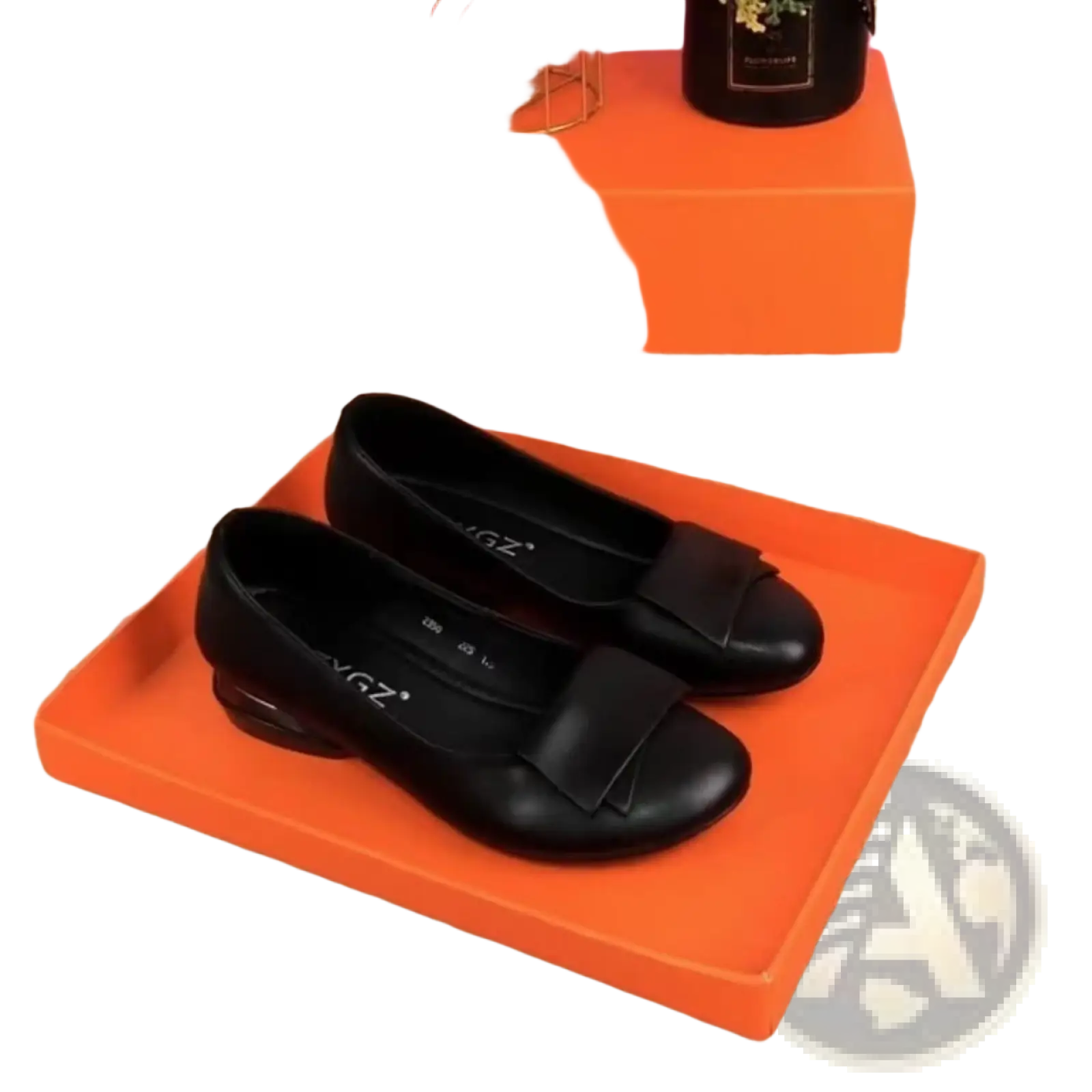 Black leather loafers with square toe and bow detail on the toe, showing the front view of the flat shoes