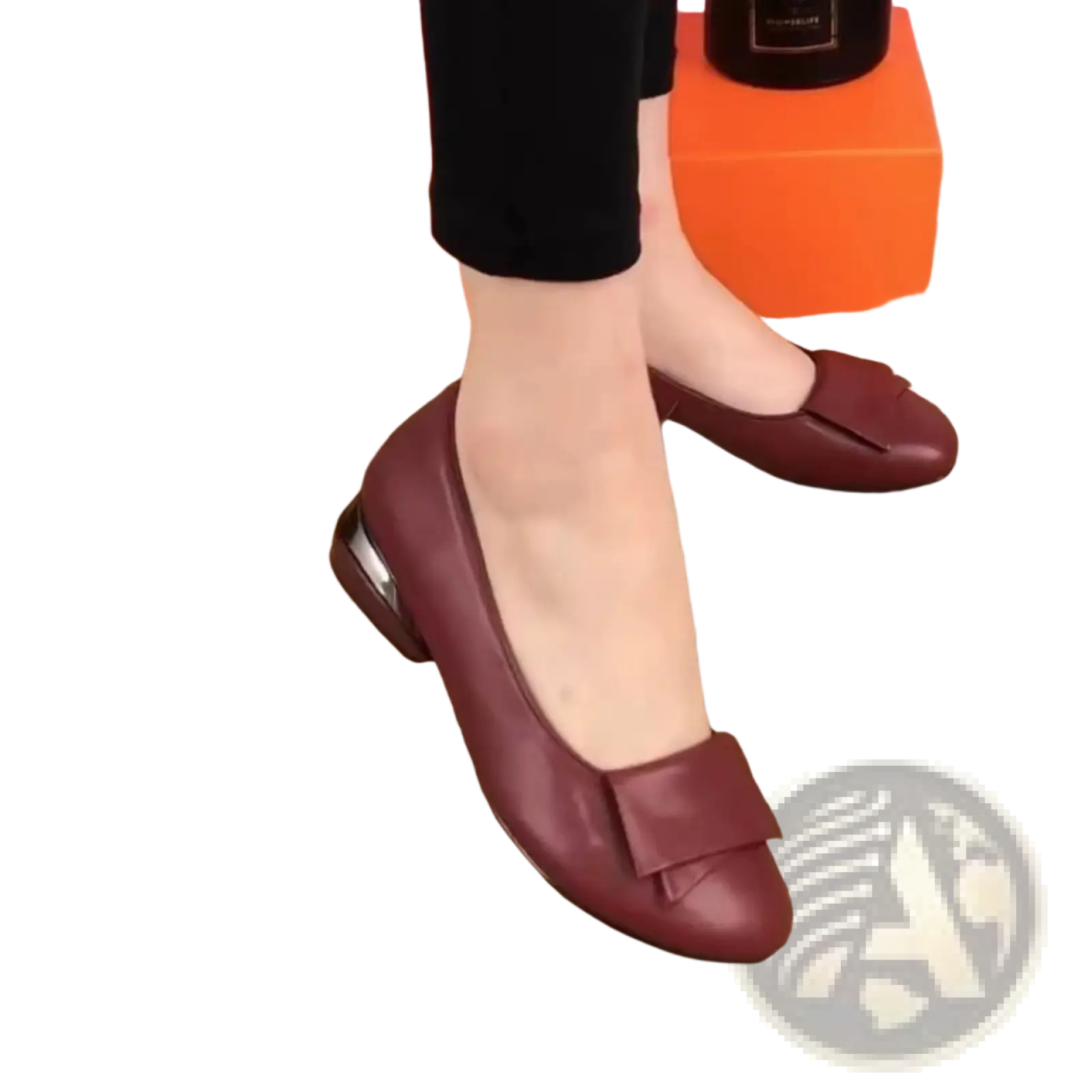 Burgundy leather loafers with square toe and decorative bow detail perfect for formal and casual wear