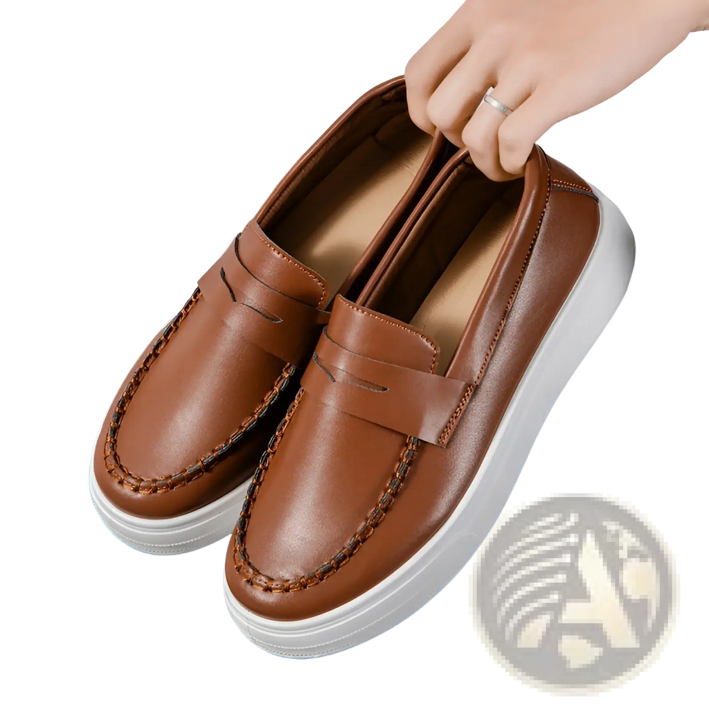 Brown leather loafers with white rubber soles and decorative stitching designed for stylish casual wear