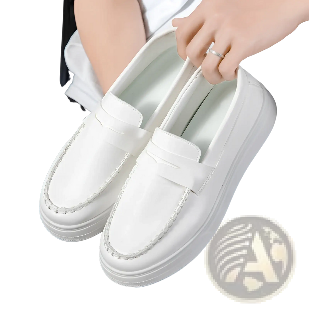 White leather loafers with thick white rubber platform soles and decorative stitching along the edges