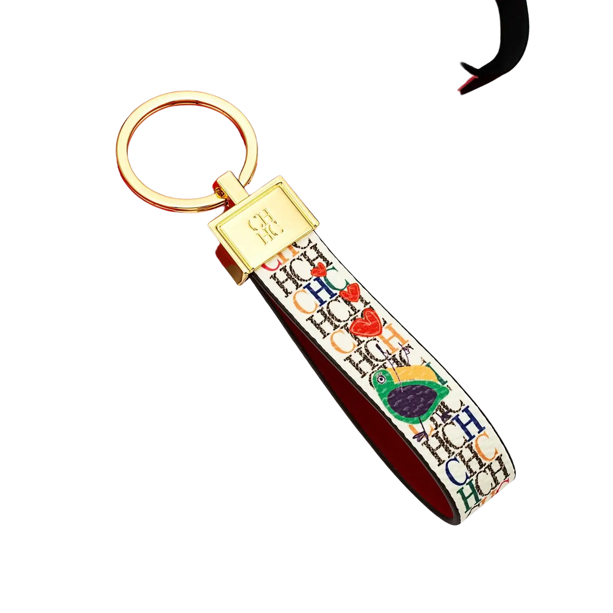 Gold-tone leather logo keychain with colorful patterned strap featuring repeating chic text and bird and heart illustrations