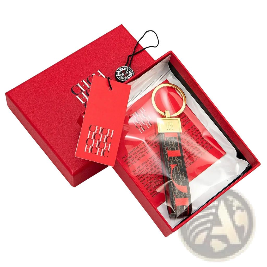 Leather logo keychain gold toned with black strap featuring red chic lettering and hugo boss logo designer accessory gift