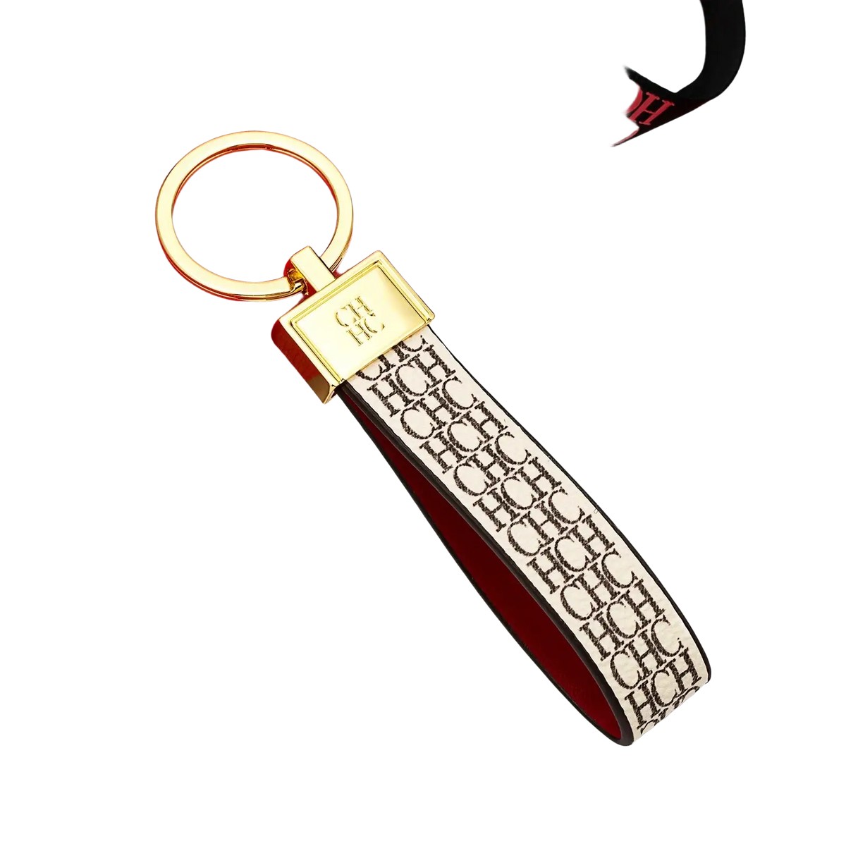 Gold-toned leather logo keychain with rectangular plaque and cream leather strap featuring chc monogram design