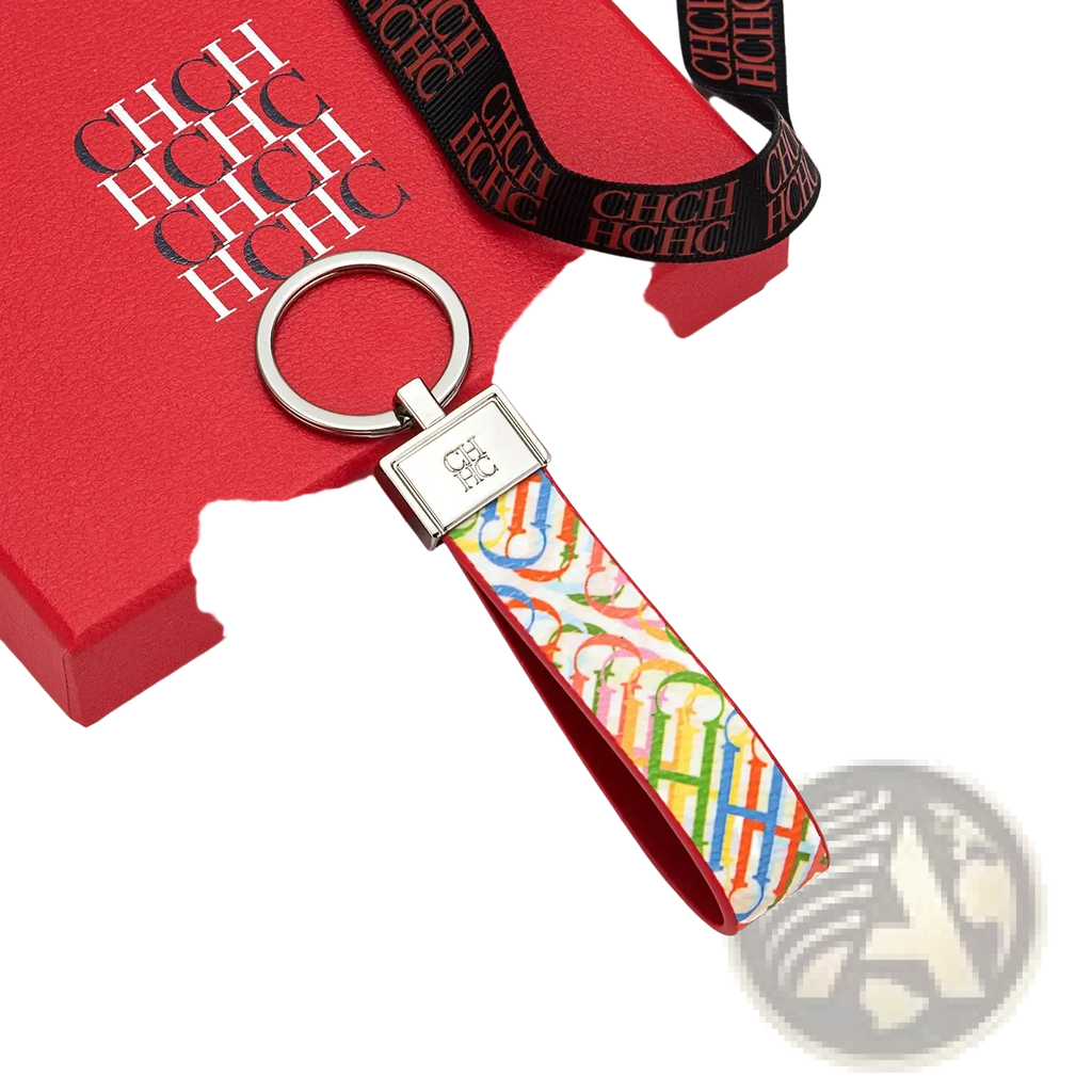 A vibrant rainbow-colored leather logo keychain with a sleek silver metal ring and rectangular plaque accessory gift