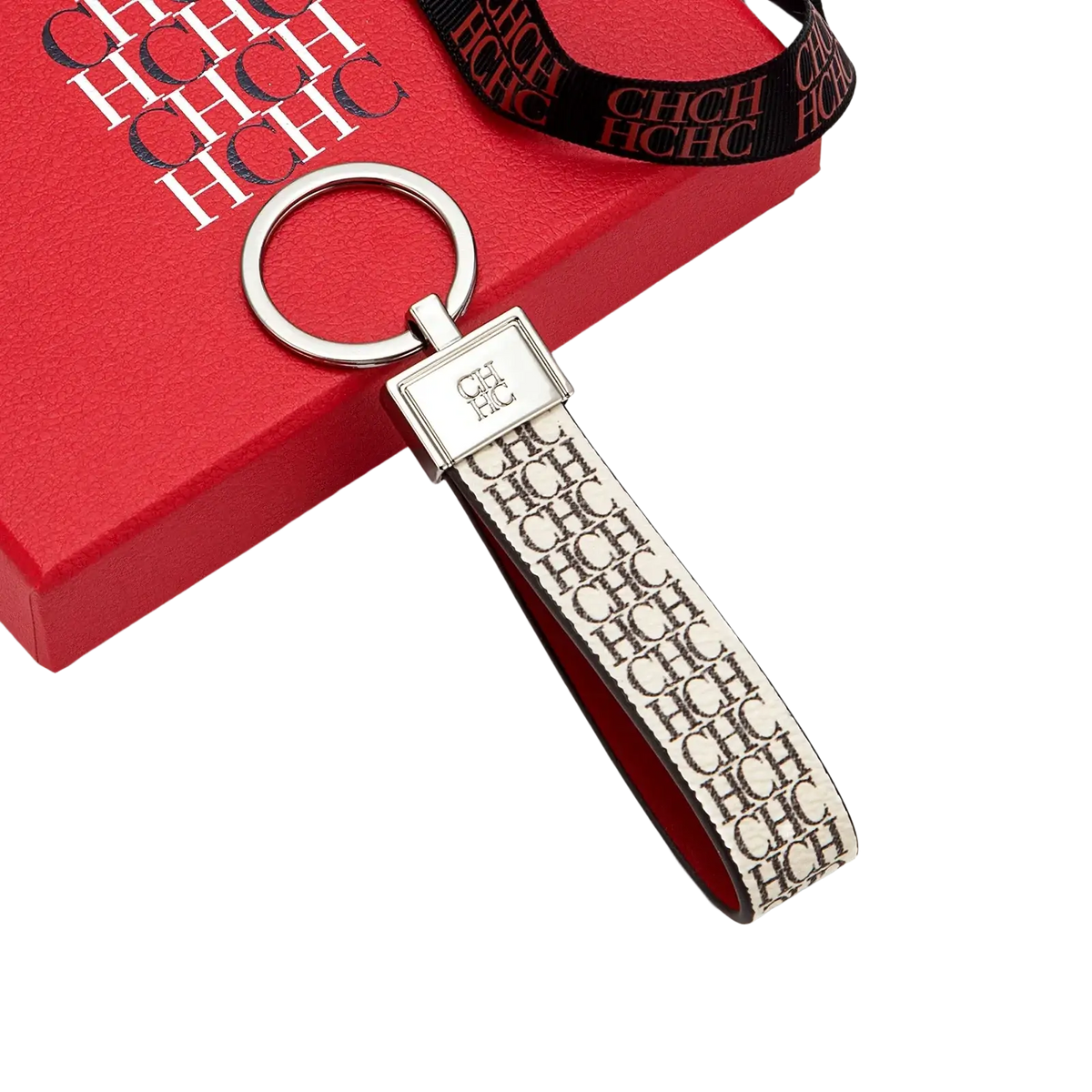 A sleek cream-colored leather logo keychain with a repeating black chc pattern and silver metal ring gift accessory