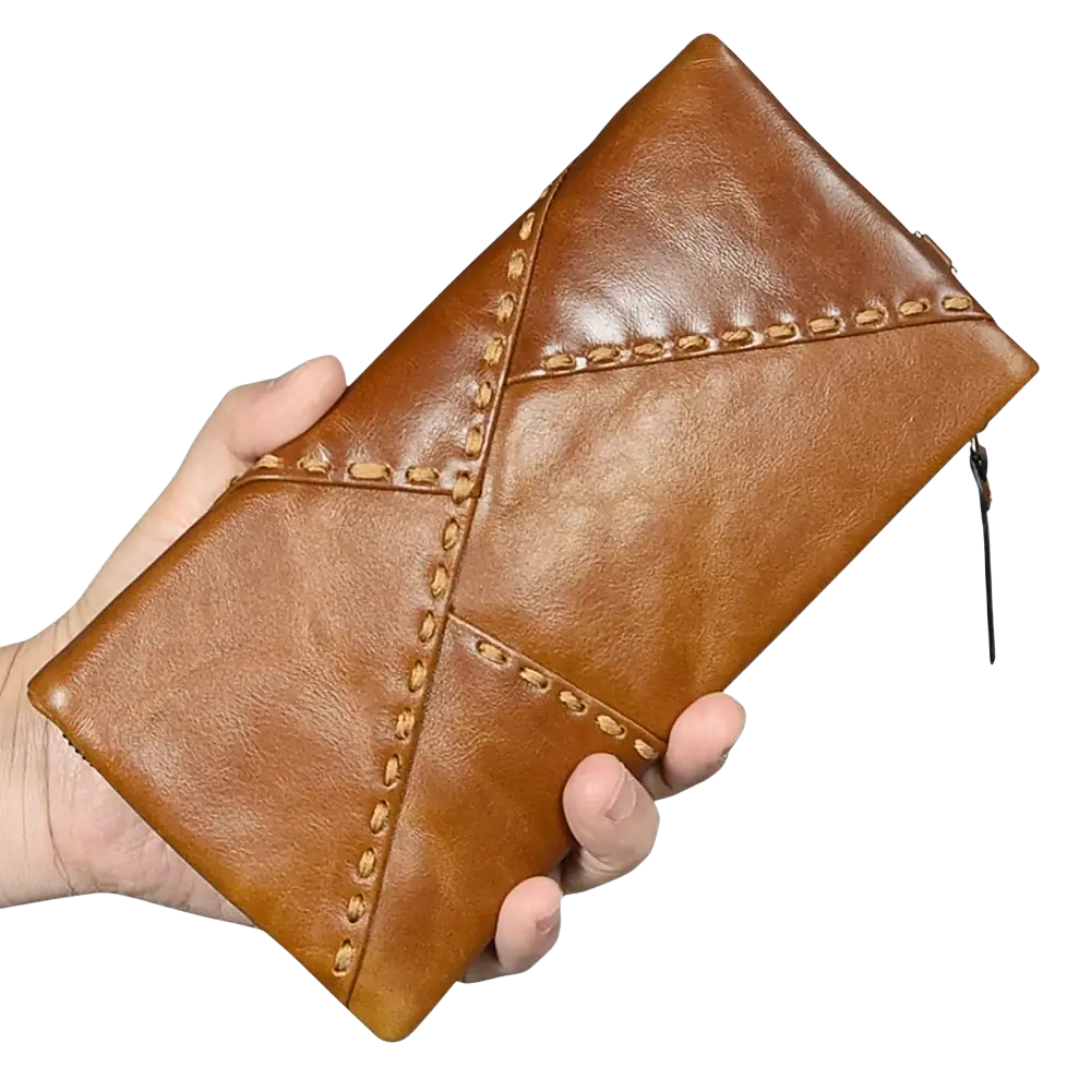 A tan leather long wallet cowhide zip clutch phone purse with geometric stitched design and zipper closure