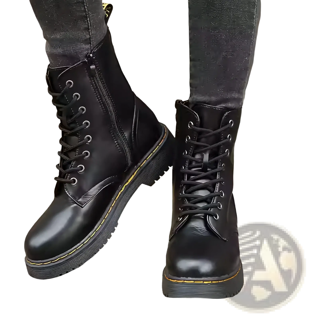 Black leather dr martin boots with round toe and flat ankle design for casual and formal wear