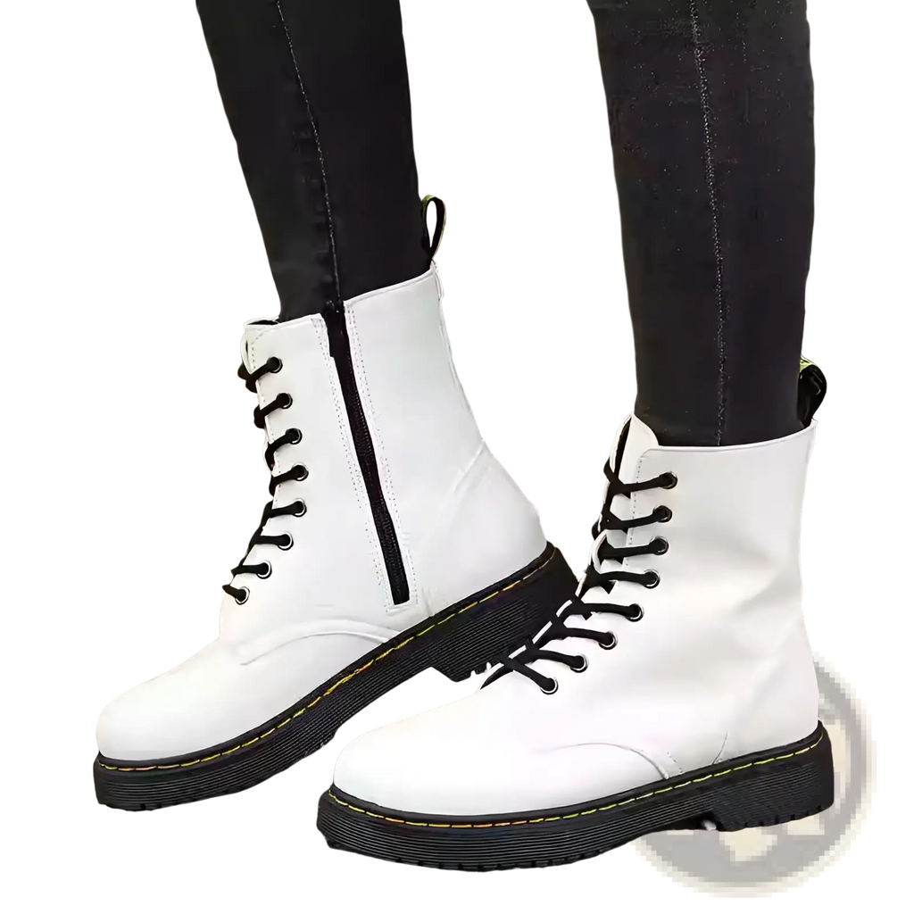 White leather martin boots with round toe flat ankle design shown from the back side of the shoe