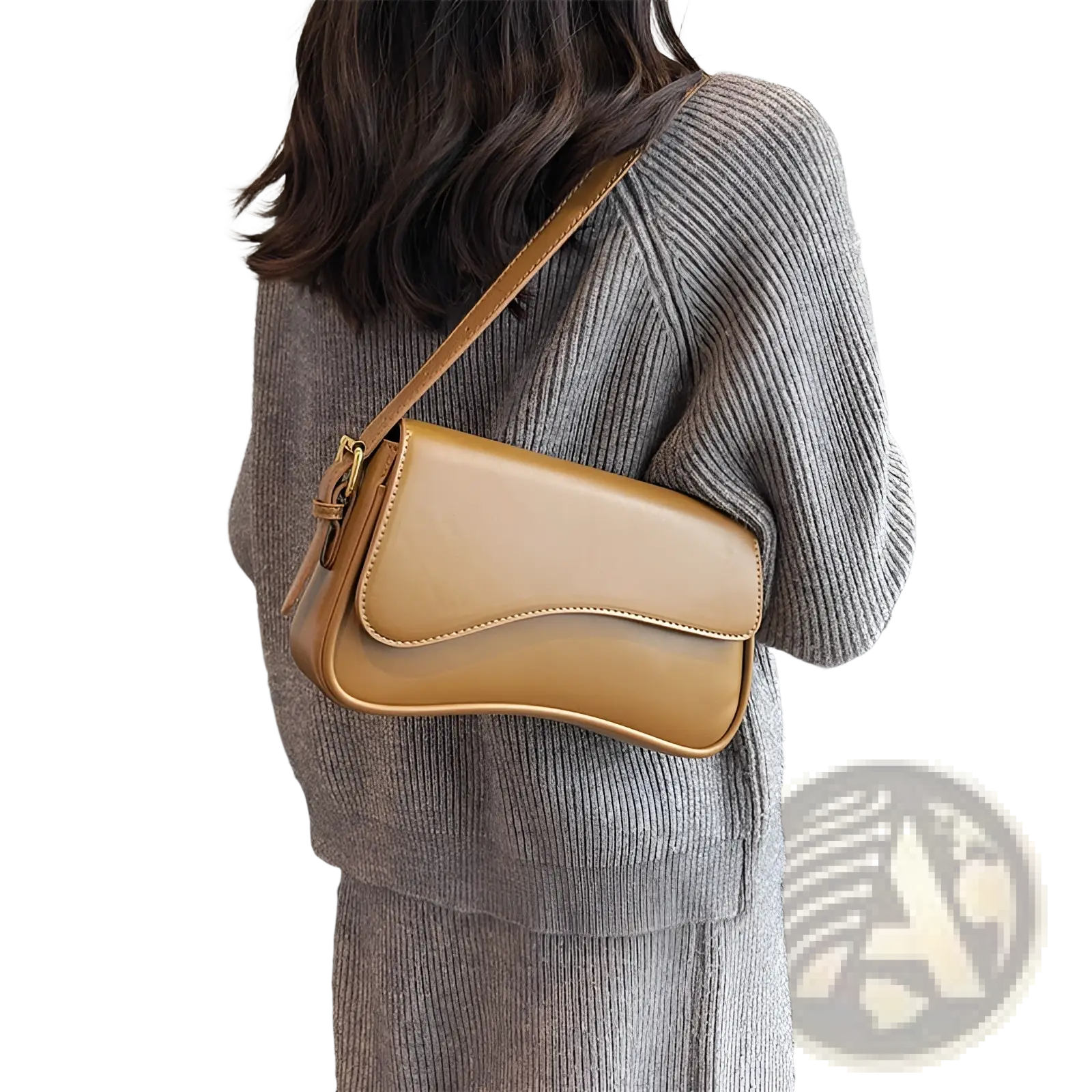 Tan leather messenger bag minimalist crossbody organ bag with a curved flap and gold-tone hardware
