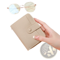 Beige textured leather mini organ wallet with button closure for secure compact storage