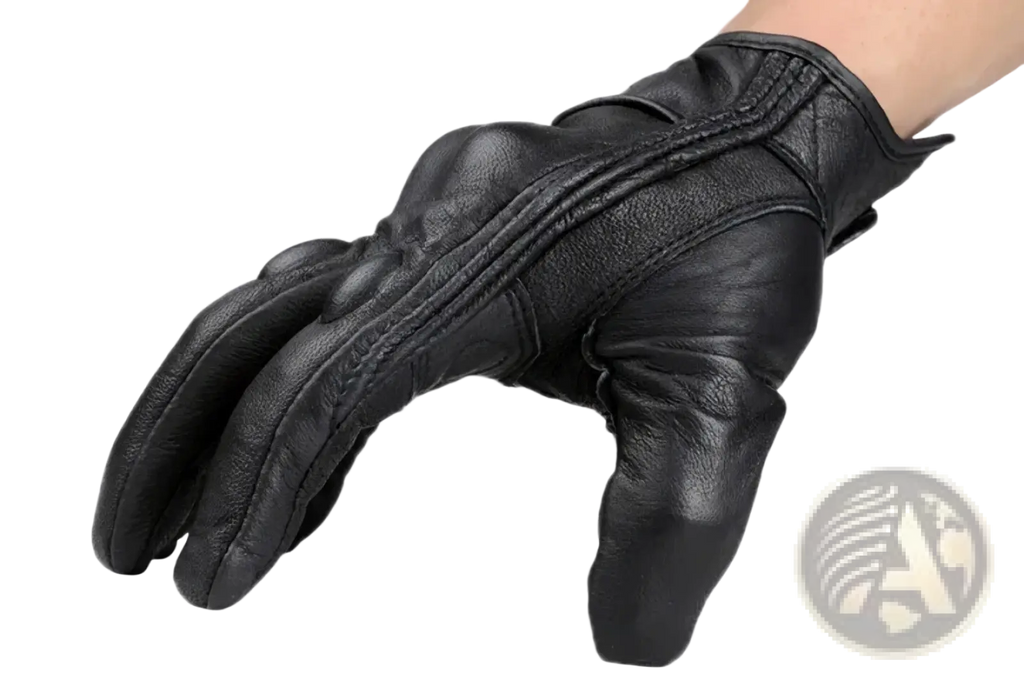 Black leather motorcycle glove with carbon knuckle protection and reinforced padding shown from the back side